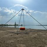 Meditation pyramid with orgonite sphere on the beach