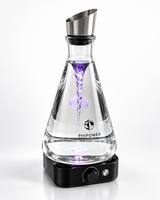 Pouring vitalized water from the Phipower Watervitalizer 2 liter into a glass